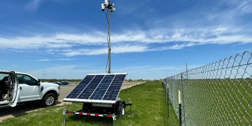 Solar Surveillance Trailer by Fence - Header