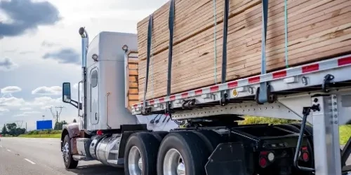 Blog Thumbnail Wide timber materials on back of a lorry