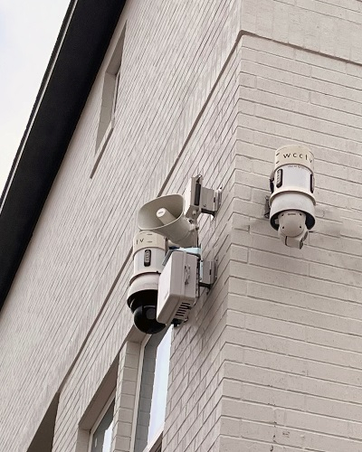 Two Pole Cameras on a Building - Thumb