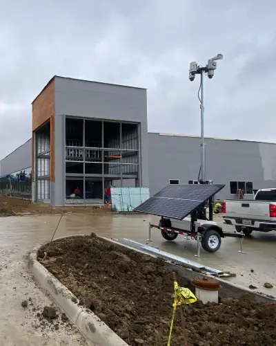 Blog Thumbnail Tall Solar Trailer outside Cadillac's new dealership being constructed