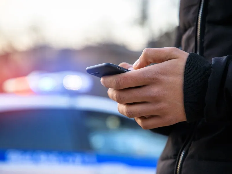 Police Officer Using a Phone